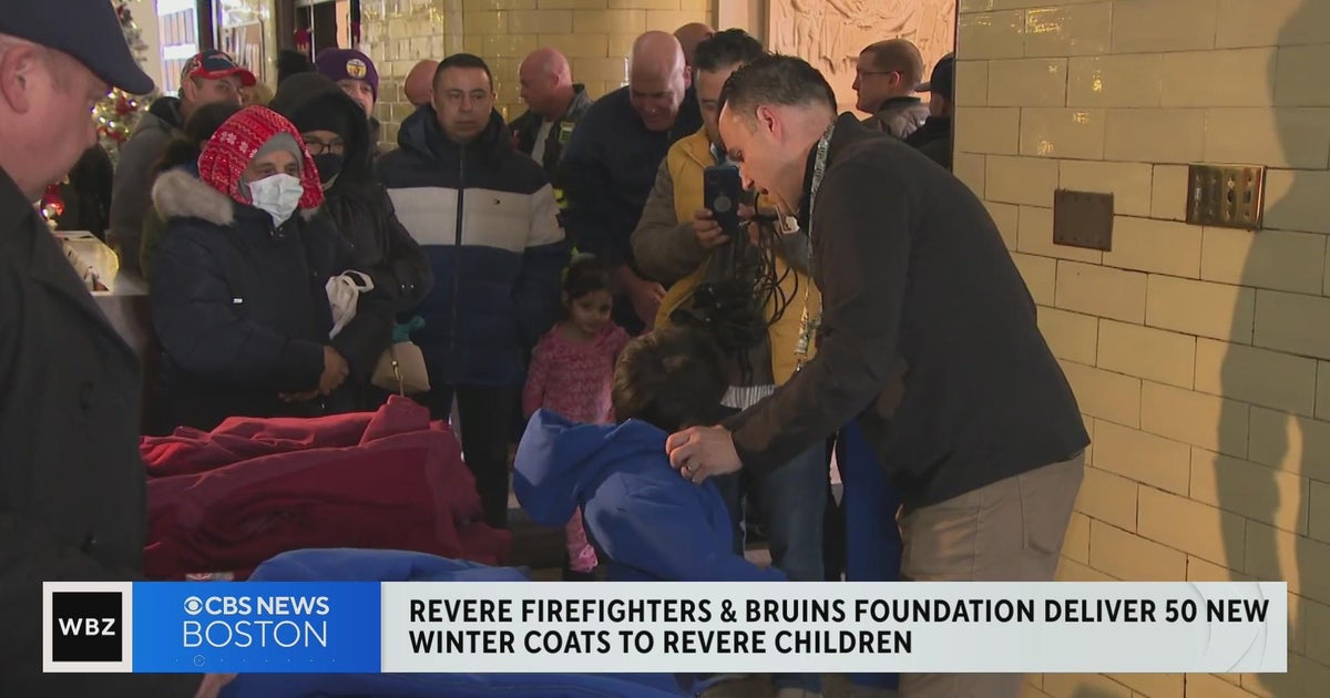 Revere firefighters and Bruins Foundation donate new winter coats to