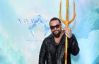 Actor Jason Momoa holds a trident at an event for his new film, "Aquaman and the Lost Kingdom" 