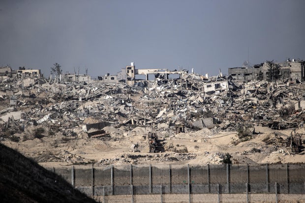 Demolished buildings in Gaza are seen from across the border in Israel as the Israeli army's air, sea and land attacks against the Gaza Strip continue on Dec. 29, 2023