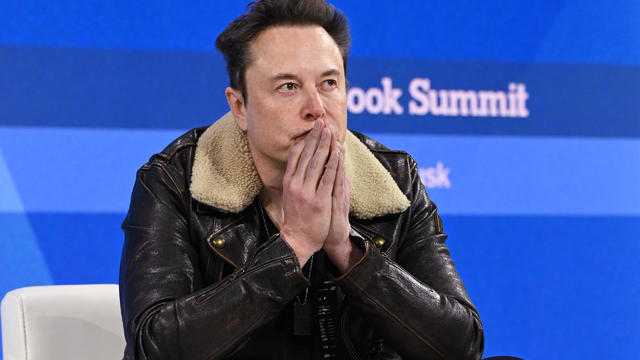 Elon Musk speaks onstage during The New York Times Dealbook Summit 