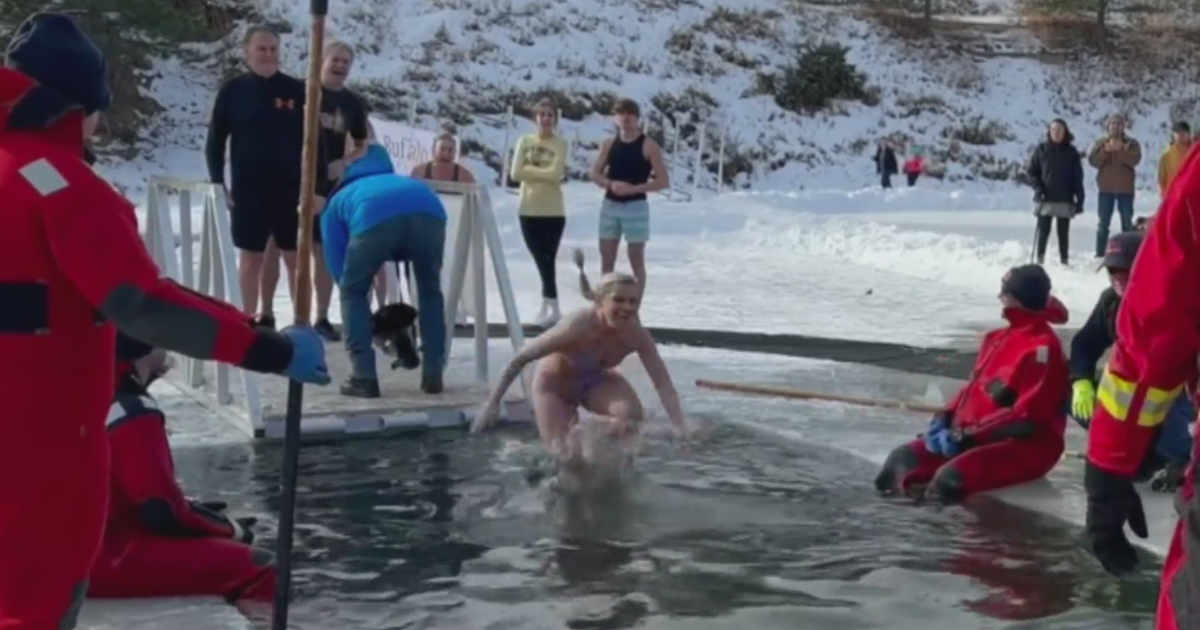 Hundred of people started the new year with a plunge into the frozen  Evergreen Lake