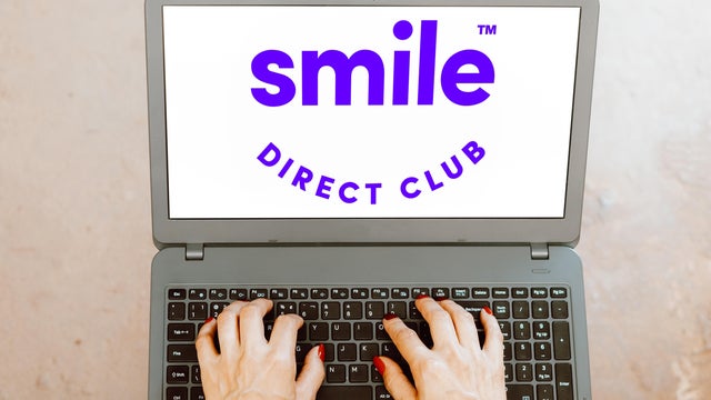 In this photo illustration, the SmileDirectClub logo is