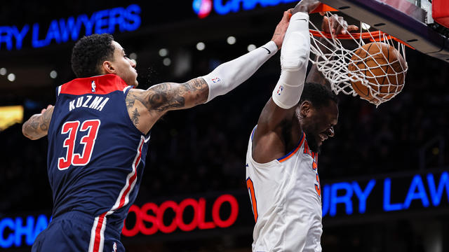 Julius Randle #30 of the New York Knicks dunks the ball against Kyle Kuzma #33 of the Washington Wizards during the first half at Capital One Arena on January 6, 2024 in Washington, DC. 
