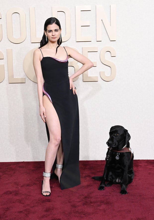 Aria Mia Loberti at the 81st Golden Globe Awards, accompanied by a guide dog