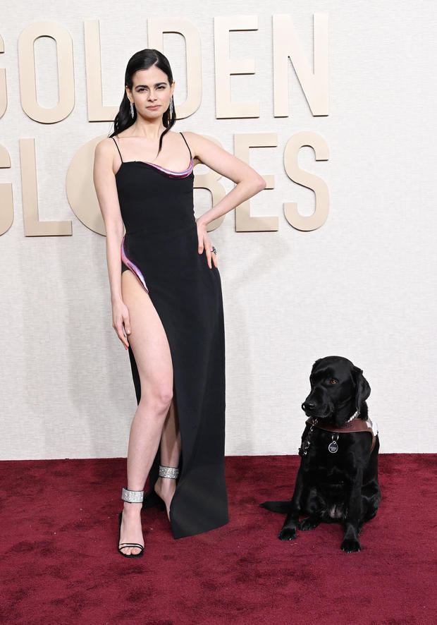 Aria Mia Loberti at the 81st Golden Globe Awards, accompanied by a guide dog 