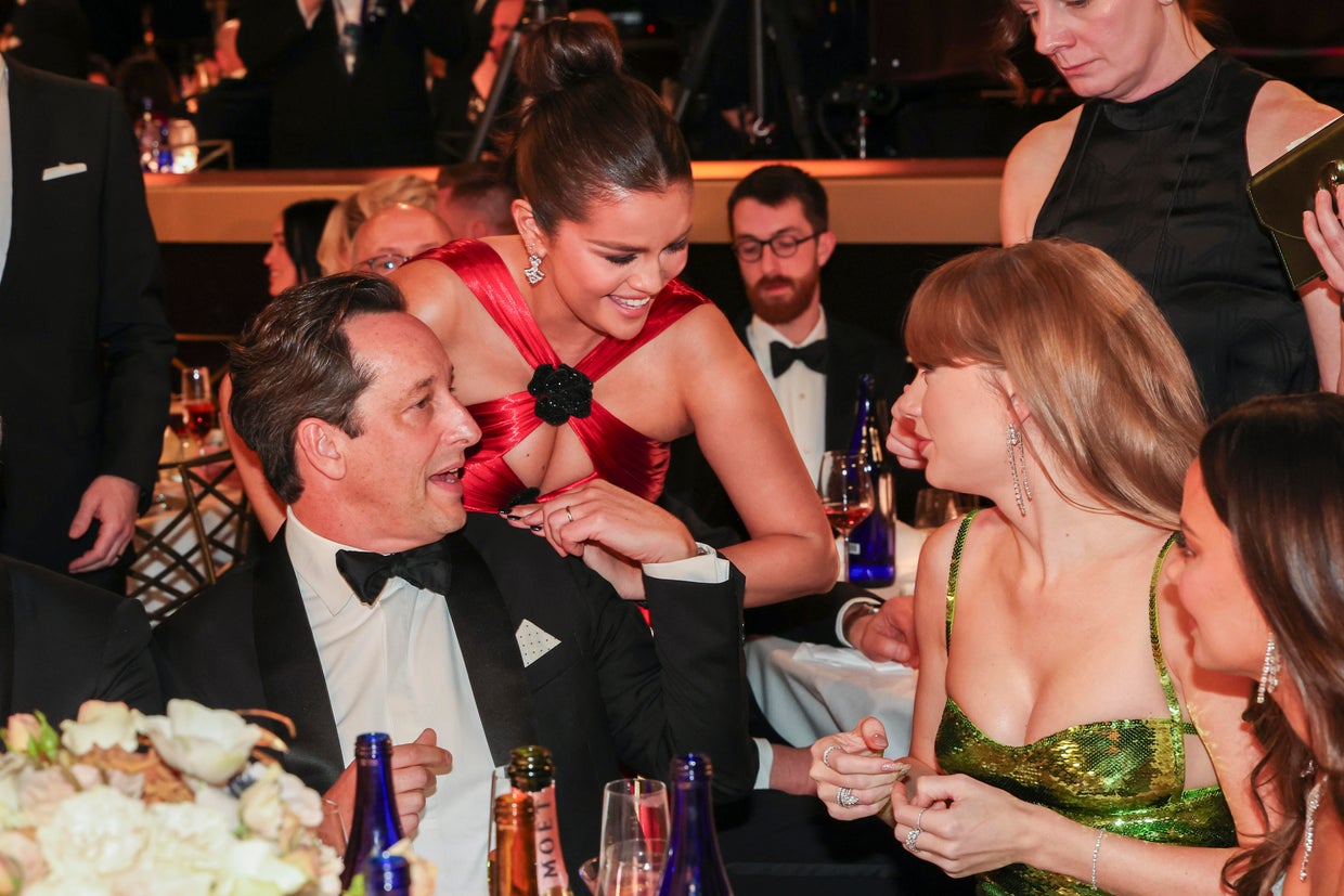 L-R: David Greenbaum, Selena Gomez and Taylor Swift at the 81st Golden Globe Awards 