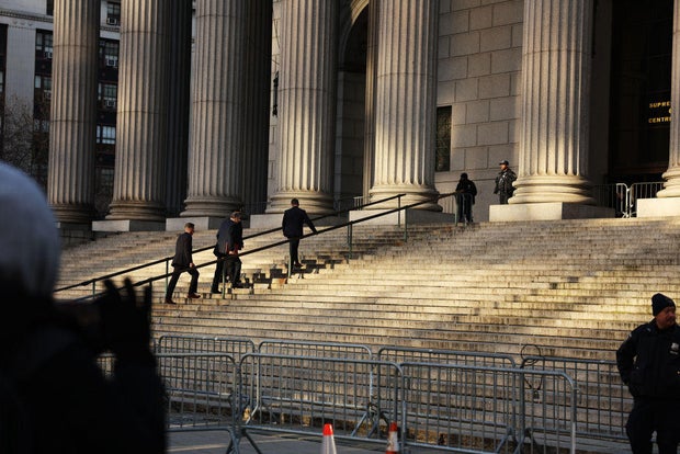 People enter New York Supreme Court during closing arguments for former President Donald Trump's civil fraud trial on Jan. 11, 2024.