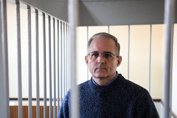 Paul Whelan stands inside a defendants' cage during a hearing at a court in Moscow on Aug. 23, 2019.