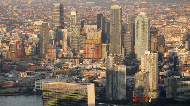 Buildings in Long Island City, Queens stand behind the headquarters of the United Nations seen from the 86th floor of the Empire State Building on September 6, 2023, in New York City. The Arthur Ashe tennis stadium is in the background at the Billie Jean King National Tennis Center, home to the US Open Tennis Championships. 