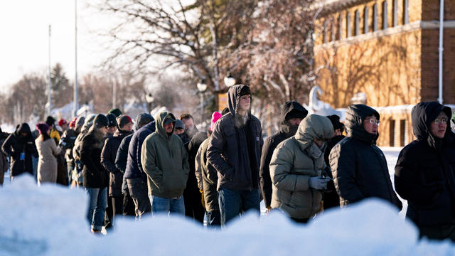 Attendees wait in line outside prior to a campaign event at Simpson College in Indianola, Iowa, on Sunday, Jan. 14, 2024. 