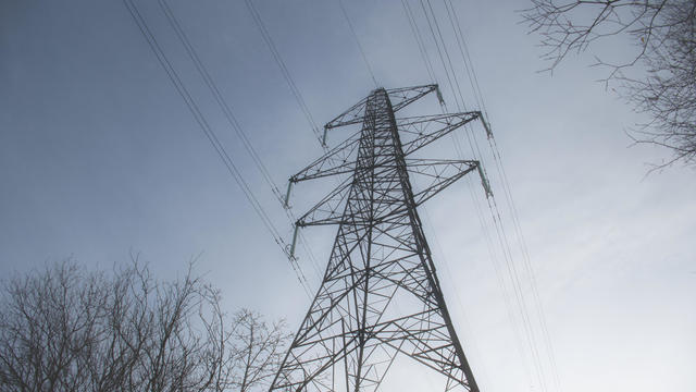 A high voltage electricity transmission pylon in winter in the UK 