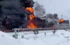 Firefighters extinguish oil tanks at a storage facility in Klintsy 