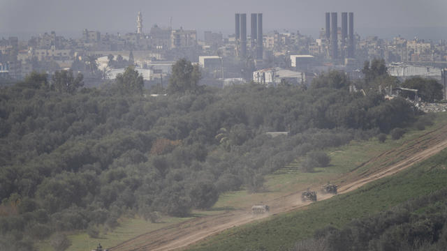 Israeli forces move near the Israeli-Gaza border, in southern Israel, Thursday, Jan. 18, 2024. 