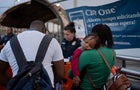 Haitian migrants, who have an appointment via the CBP One app, show their documents to U.S. Border Patrol agents on the Paso del Norte Bridge between El Paso, Texas, and Ciudad Ju&aacute;rez, Mexico, on June 30, 2023. 
