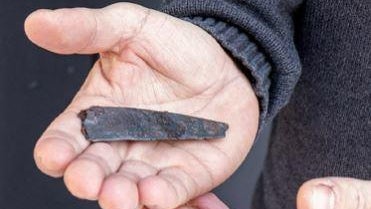 Archaeologists say single word inscribed on iron knife is oldest writing ever found in Denmark