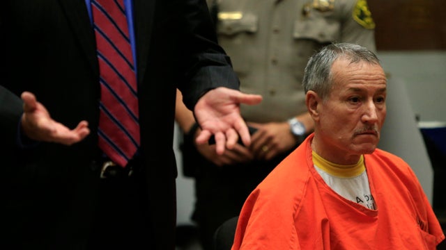 Former Los Angeles Miramonte Elementary School teacher Mark Berndt, 62, right, sits with his attorn 