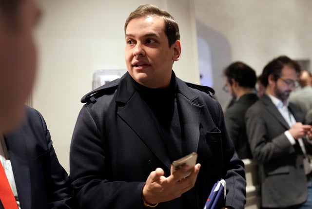 Former Rep. George Santos arrives before former President Donald Trump's primary event in Nashua, New Hampshire, on Tuesday, Jan. 23, 2024.