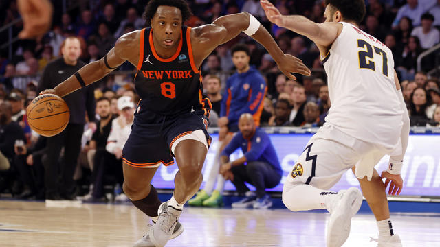 OG Anunoby #8 of the New York Knicks dribbles against Jamal Murray #27 of the Denver Nuggets during the second half at Madison Square Garden on January 25, 2024 in New York City. 