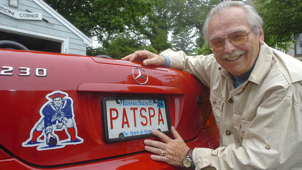 (07/01/09 Rockport, Ma) The Herald meets Patriots logo creator Phil Bissell at his studio inside his home. Portrait of Bissell with his vanity plate on his car. . Staff Photo by Patrick Whittemore. Saved in Thursday and ad sports and archive 