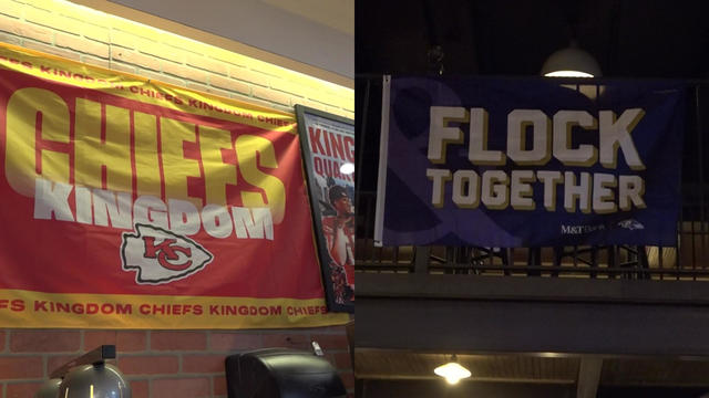 On the left: A Chiefs Kingdom Kansas City Chiefs flag on the wall of a Queens bar; on the right: A Flock Together Baltimore Ravens flag on the balcony of a Midtown bar. 