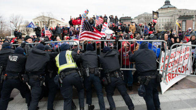 U.S. Capitol Police scuffle with rioters outside of the U.S. Capitol building in Washington on Wednesday, Jan. 6, 2021. 