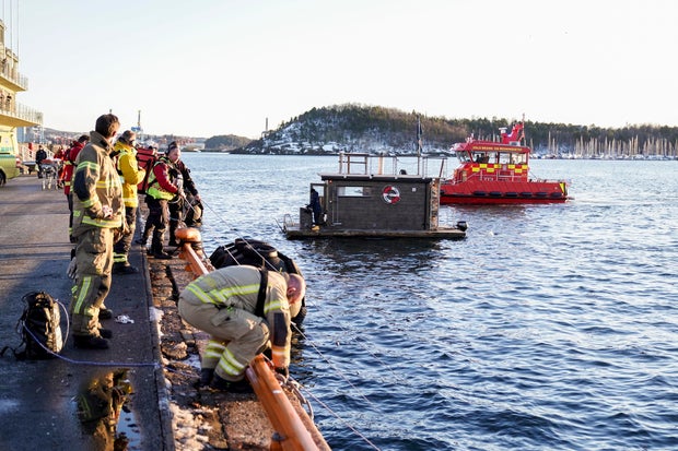 A floating sauna, center, is seen near where rescue personnel retrieved a car that plunged into the Oslofjord on Feb. 1, 2024, in Oslo