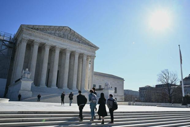 People walk outside the Supreme Court in Washington, D.C., on Feb. 5, 2024. 