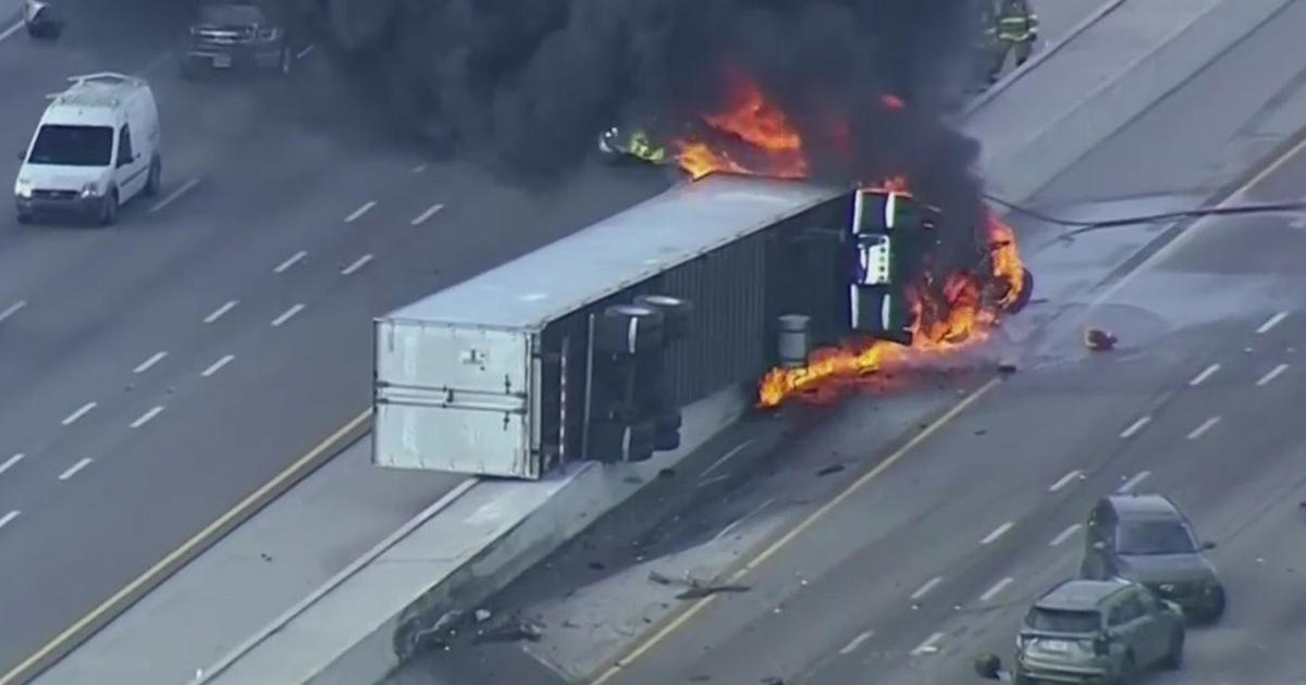 Tractor trailer overturned, caught hearth on Turnpike Extension around I-75