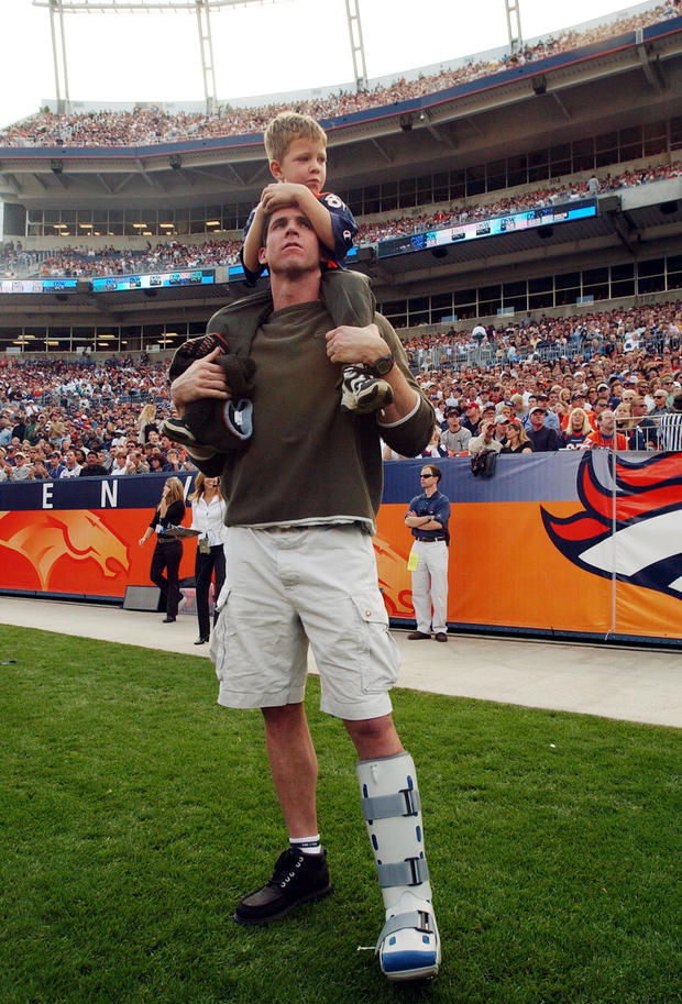 Ed McCaffrey and his son Christian watch first quarter action from the sideline during the Denver Broncos 31-20 victory over the New England Patriots. (craig f walker/ the denver post) 10/28/01 