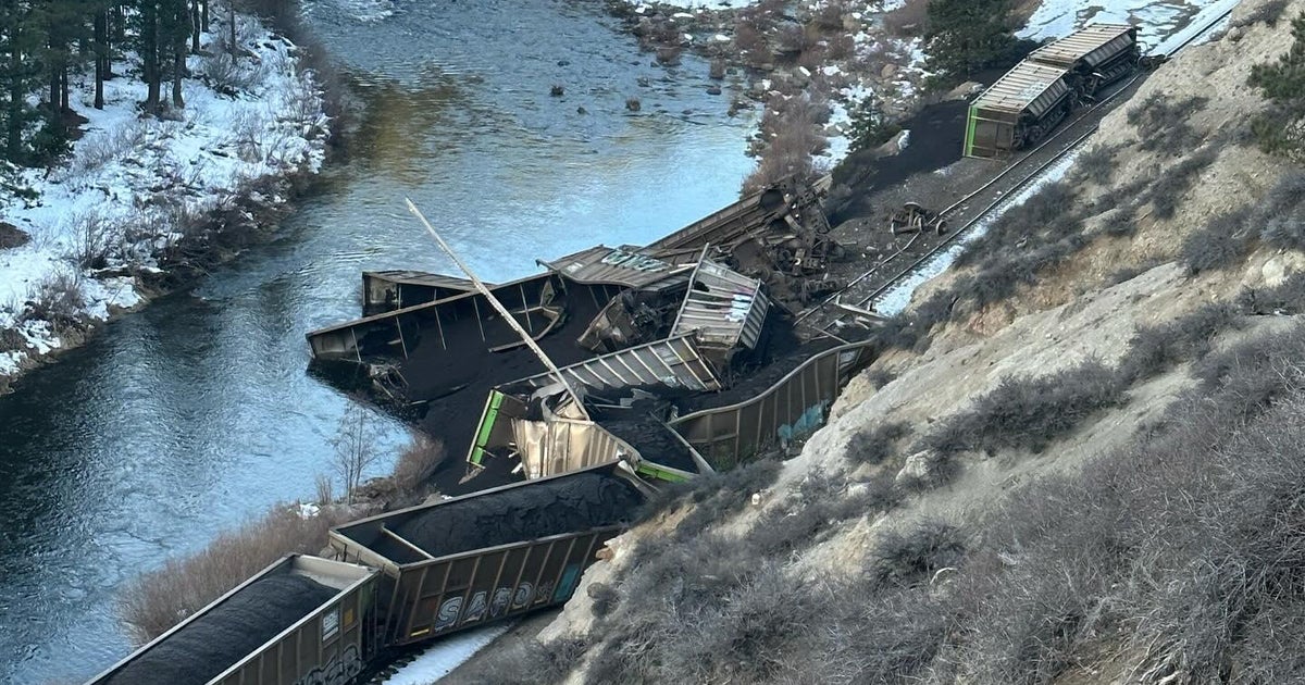 Train derails in Northern California canyon, spiling coal into river