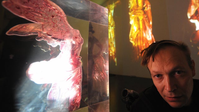 Russian artist Andrei Molodkin poses nea 