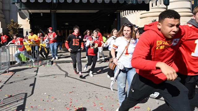 People flee after shots were fired near the Kansas City Chiefs' Super Bowl victory parade on Feb. 14, 2024, in Kansas City, Missouri. 