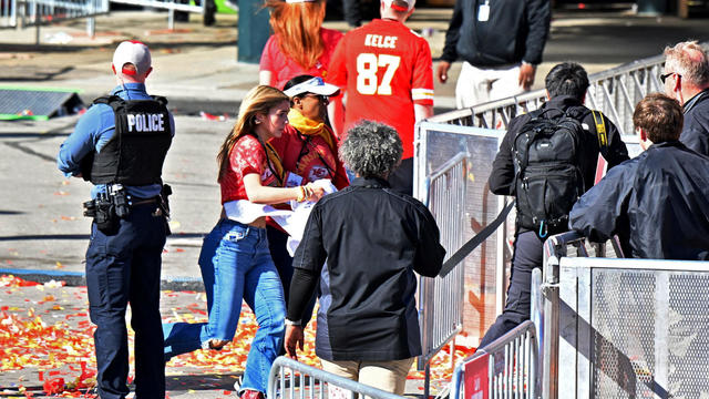 Fans leave the area of the Kansas City Chiefs' Super Bowl celebration after shots were fired Feb. 14, 2024, in Kansas City, Missouri. 