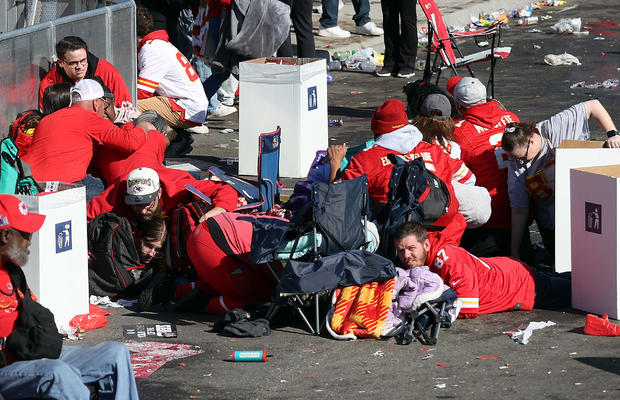 People take cover during a shooting at Union Station during the Kansas City Chiefs