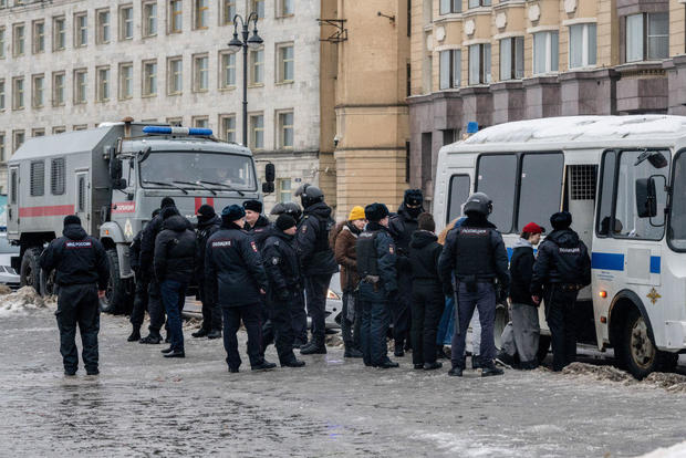 Police in St. Petersburg detain people after laying flowers at the Memorial to Victims of Political Repression to honor Russian opposition leader Alexei Navalny on Saturday, Feb. 17, 2024. 