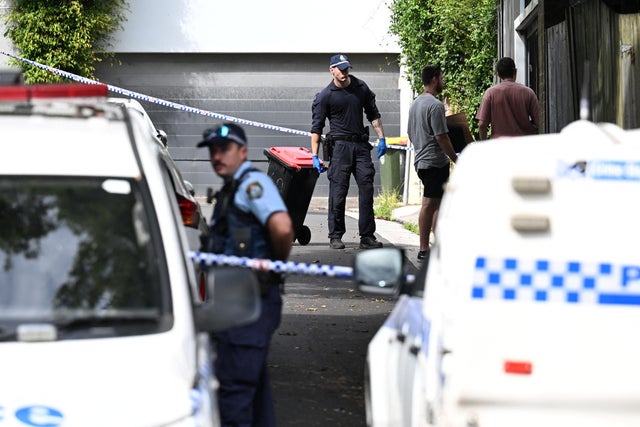 Police officers work at a crime scene at Waite Road in Paddington, Sydney, Australia, Feb. 23, 2024. 