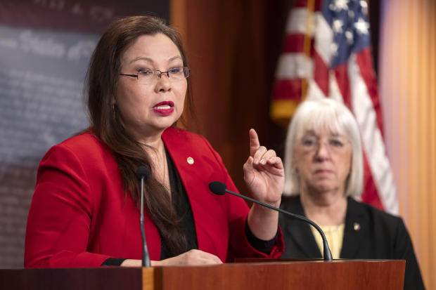 Sen. Tammy Duckworth speaks about a bill to establish federal protections for IVF as Sen. Patty Murray listens during a press event on Capitol Hill on Tuesday, Feb. 27, 2024. 