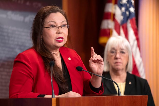 Sen. Tammy Duckworth speaks about a bill to establish federal protections for IVF as Sen. Patty Murray listens during a press event on Capitol Hill on Tuesday, Feb. 27, 2024.