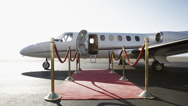 Private airplane with red carpet 