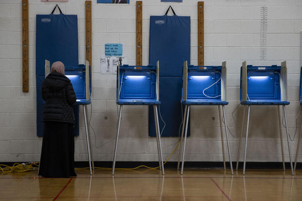 People vote at a voting site as Democrats and Republicans hold their Michigan primary presidential election in Dearborn, Michigan, United States on February 27, 2024. 