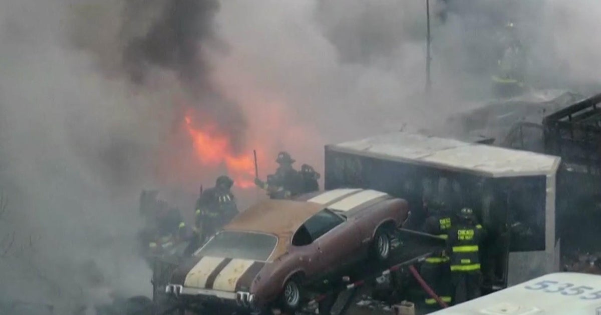 Fire spreads through junkyard on Chicago's West Side - CBS Chicago
