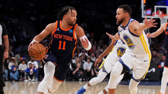 Jalen Brunson #11 of the New York Knicks drives to the basket against Stephen Curry #30 of the Golden State Warriors at Madison Square Garden on February 29, 2024 in New York City. 
