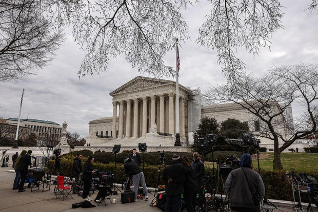 Members of the media outside the Supreme Court in Washington, D.C., on Monday, March 4, 2024.