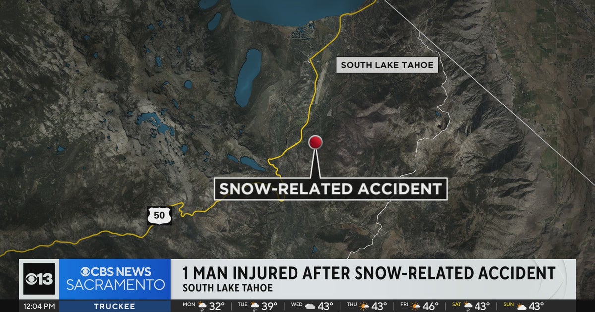 Man injured after truck stuck in snow rolls over him