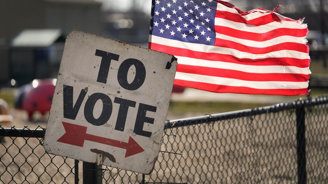 Election 2024 primary voting sign and American flag