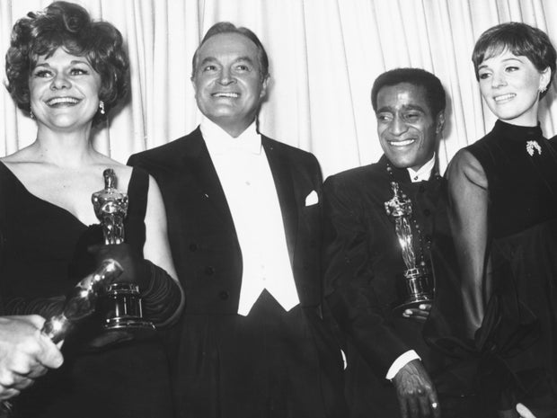 From left, Estelle Parsons, holding her best supporting actress Oscar; host Bob Hope; Sammy Davis Jr., who accepted an award for someone else; and past winner Julie Christie are seen at the Academy Awards in Los Angeles, April 10, 1968.