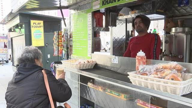 A food truck owner serves a customer in Philadelphia 