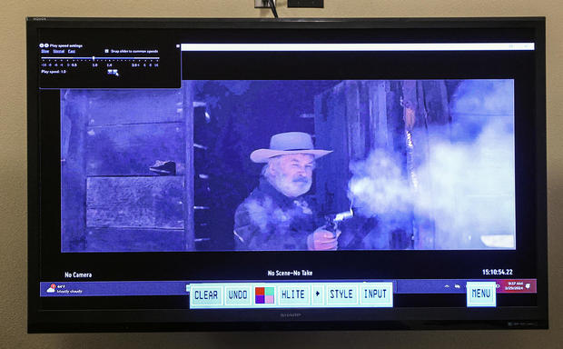 A still from a video clip displayed at the First Judicial District Courthouse shows actor Alec Baldwin during "Rust" film set armorer Hannah Gutierrez-Reed's involuntary manslaughter trial in Santa Fe, New Mexico, Feb. 29, 2024. 