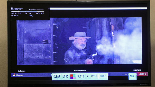 A still from a video clip displayed at the First Judicial District Courthouse shows actor Alec Baldwin during "Rust" film set armorer Hannah Gutierrez-Reed's involuntary manslaughter trial in Santa Fe, New Mexico, Feb. 29, 2024. 