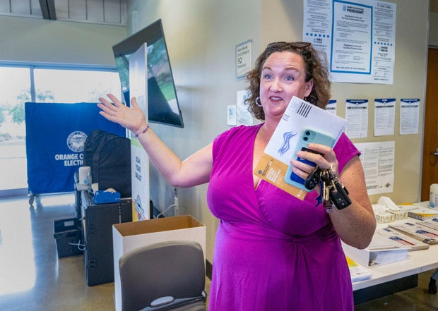 Rep. Katie Porter speaks to the media at a polling place in Irvine, California, on Saturday, March 2, 2024.
